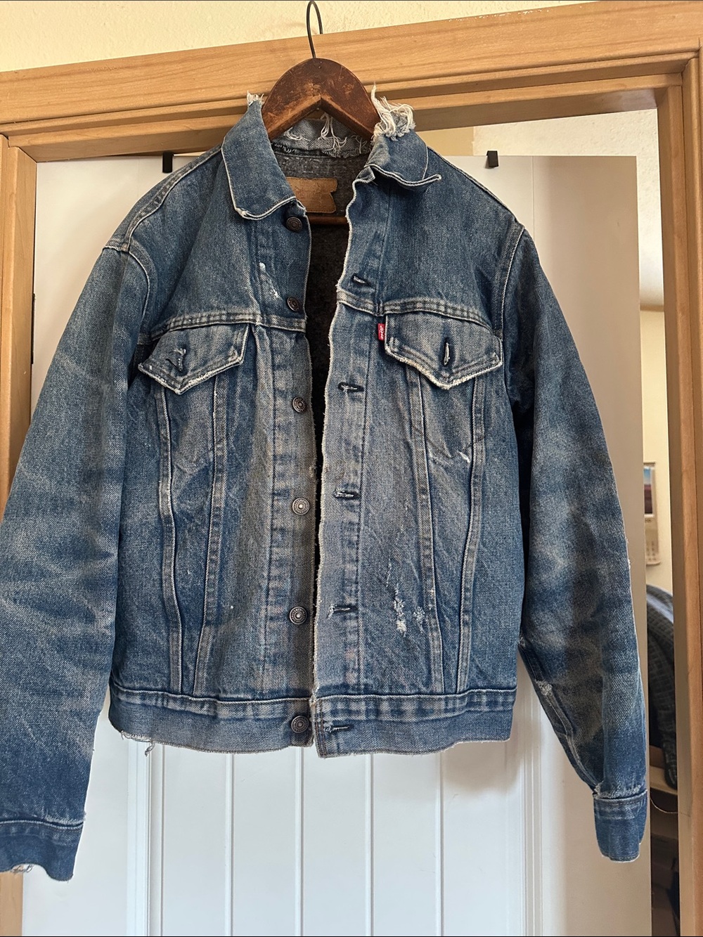 Levi's Faded Blue Denim Trucker Jacket with Distressed Trim